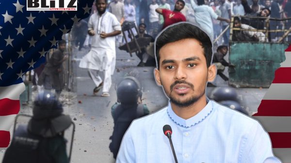 Asif Mahmud Shojib Bhuyain standing in front of microphone